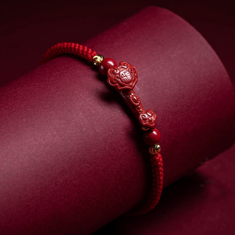 Cinnabar Ruyi Fu PiXiu Red Bracelet – Ruyi bracelet on red velvet roll dramatic studio lighting, product showcase