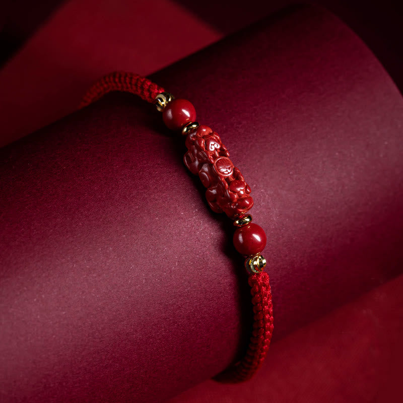 Cinnabar Ruyi Fu PiXiu Red Bracelet – PiXiu bracelet on red velvet roll dramatic lighting, Chinese talisman