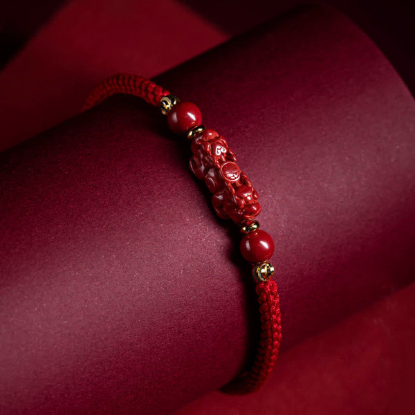 Cinnabar Ruyi Fu PiXiu Red Bracelet – PiXiu bracelet on red velvet roll dramatic lighting, Chinese talisman