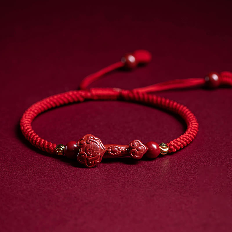 Cinnabar Ruyi Fu PiXiu Red Bracelet – single Ruyi bracelet flat on red velvet with adjustable cord, front view
