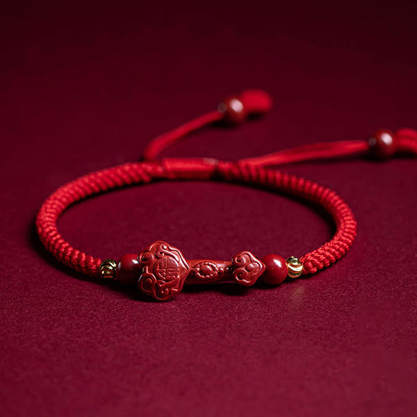 Cinnabar Ruyi Fu PiXiu Red Bracelet – single Ruyi bracelet flat on red velvet with adjustable cord, front view