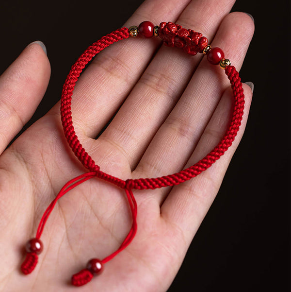 Cinnabar Ruyi Fu PiXiu Red Bracelet – PiXiu bracelet in woman's palm showing full design, lucky charm gift