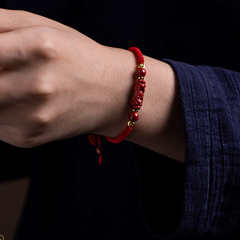 Cinnabar Ruyi Fu PiXiu Red Bracelet – PiXiu bracelet worn on man's wrist dark background, unisex red jewelry