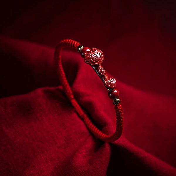 Cinnabar Ruyi Fu PiXiu Red Bracelet – single cinnabar Ruyi bracelet on red silk fabric, dramatic lighting, spiritual jewelry