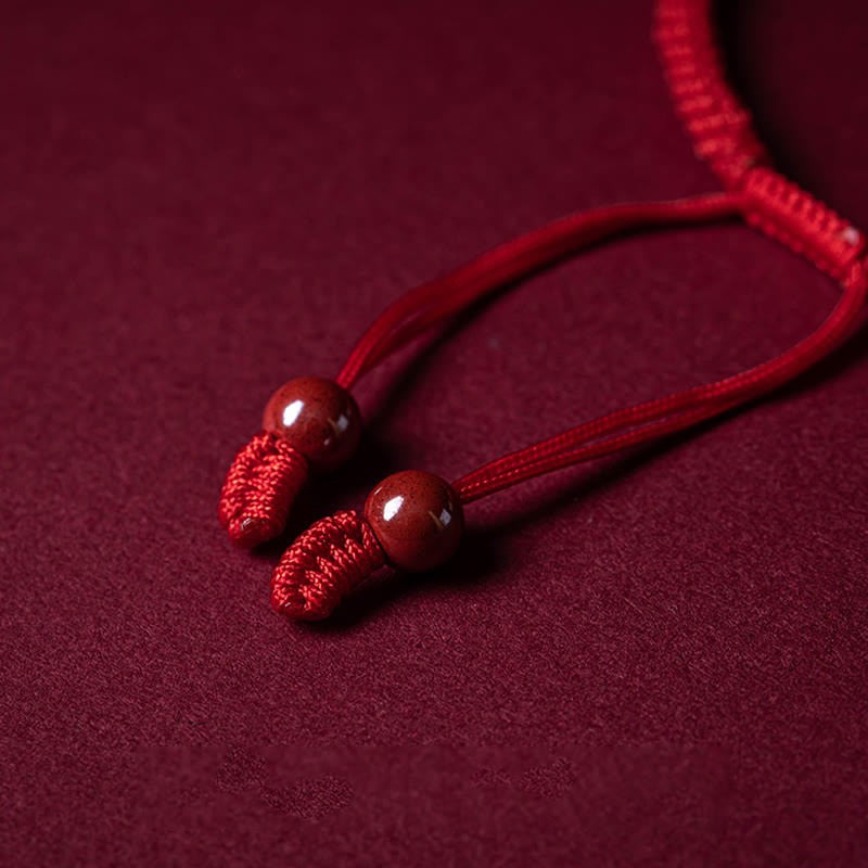 Cinnabar Ruyi Fu PiXiu Red Bracelet – adjustable cord ends with red beads on red velvet, bracelet closure detail