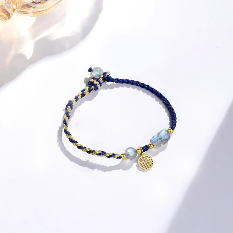 Moonstone PiXiu Tiger Eye Couple Bracelet – single blue bracelet with moonstone bead and gold Fu charm, white background