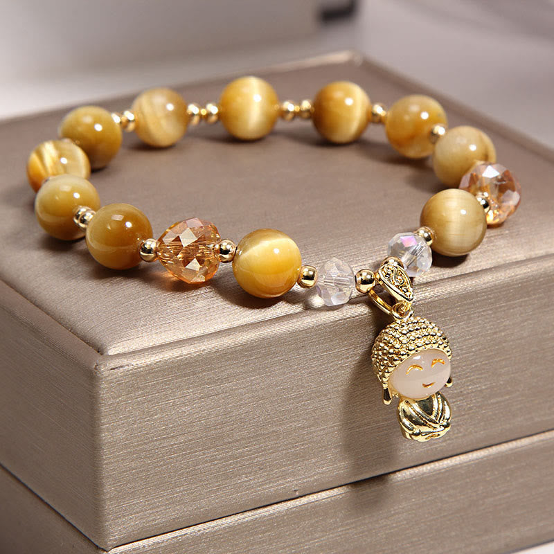 Yellow Tiger Eye Meditation Buddha Bracelet – On wrist showing chatoyant tiger eye shimmer, cat eye effect