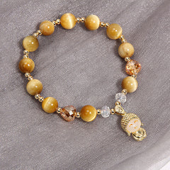 Yellow Tiger Eye Meditation Buddha Bracelet – Close-up of golden yellow stone beads with silky luster