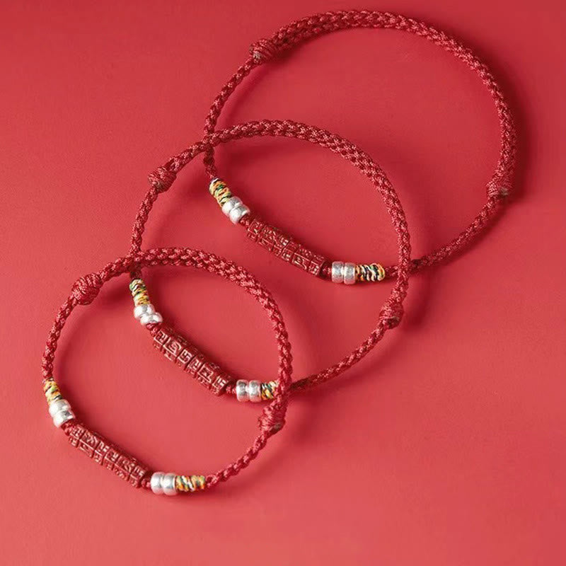 Cinnabar Om Mani Padme Hum Red String Bracelet – three bracelets stacked on red, layering jewelry