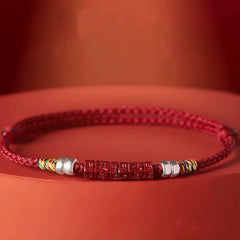 Cinnabar Om Mani Padme Hum Red String Bracelet – side view showing engraved cinnabar beads, spiritual jewelry