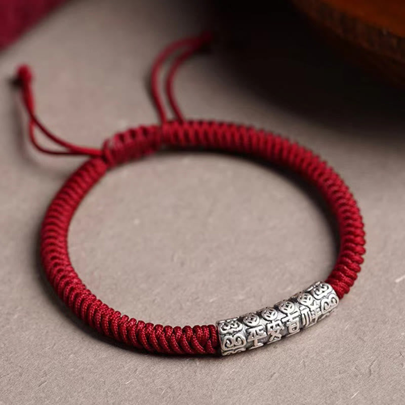 Silver Mantra Rope Bracelet – Red cord bracelet with silver blessing bead on neutral textured background, Chinese lucky br...