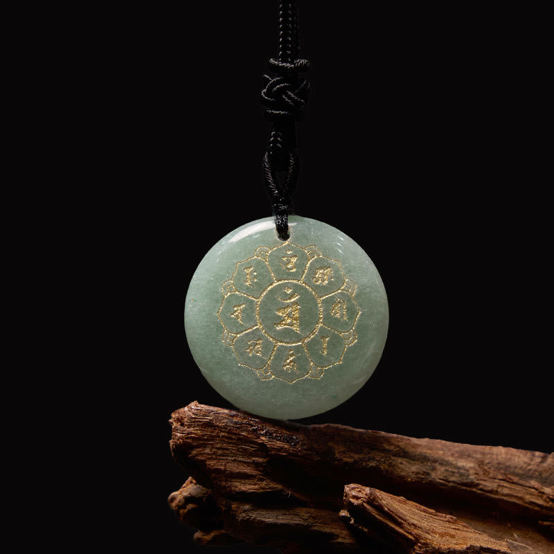 Om Mani Padme Hum Necklace – Green jade pendant with gold lotus on black with wood prop, jade mantra necklace