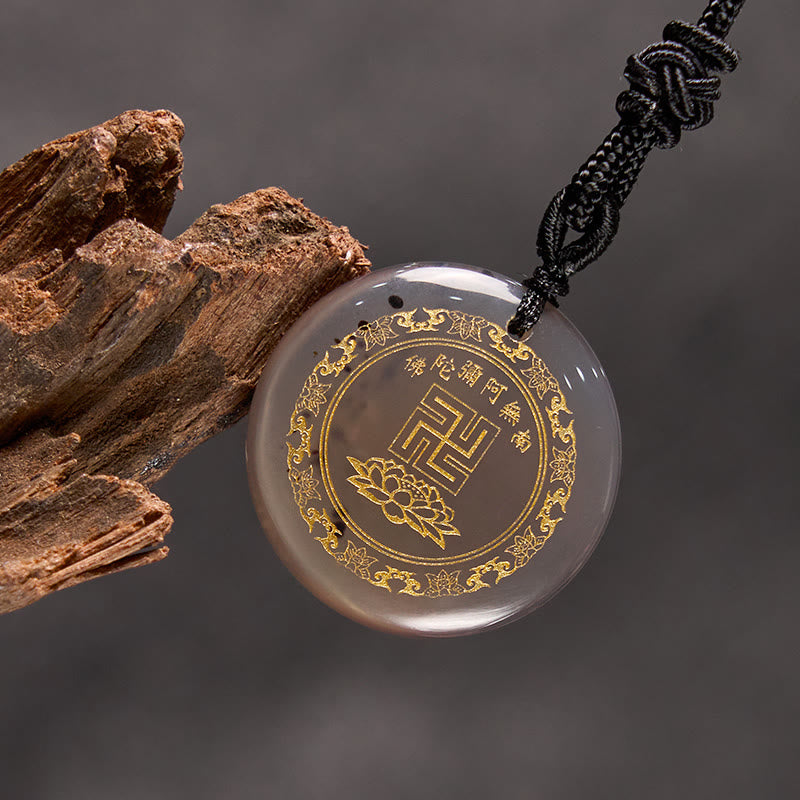Gray Chalcedony Purification Pendant - warm gray stone gold mantra on gray backdrop, wood prop, contemplative