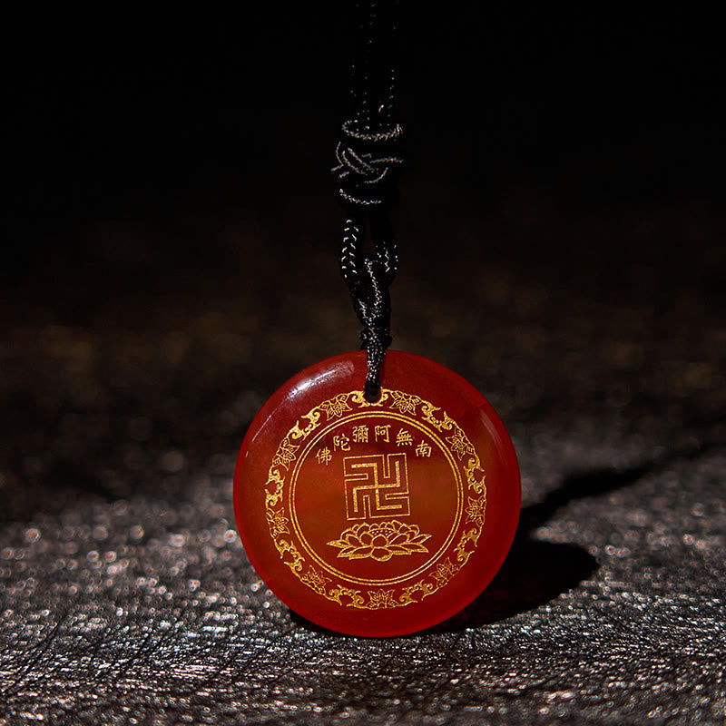Carnelian Purification Pendant - reddish-orange agate gold Amitabha engraving, dark leather bg, glowing edges