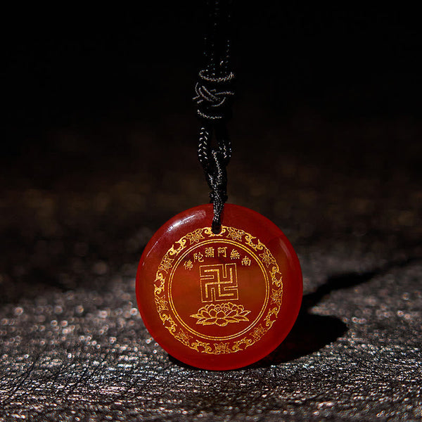 Carnelian Purification Pendant - reddish-orange agate gold Amitabha engraving, dark leather bg, glowing edges