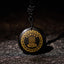 Black Obsidian Multi-Crystal Purification Pendant - low-angle view on dark slate, gold swastika & lotus on glossy obsidian, spiritual