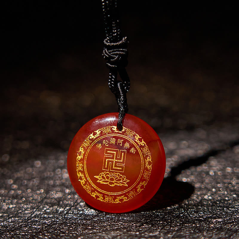 Carnelian Agate Purification Pendant - warm red stone gold Buddhist symbols, dark textured leather, devotional