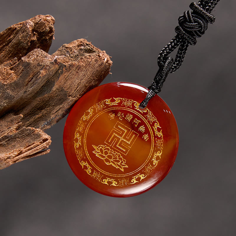 Red Agate Purification Pendant - carnelian gold lotus & mantra, gray backdrop with driftwood, warm serene