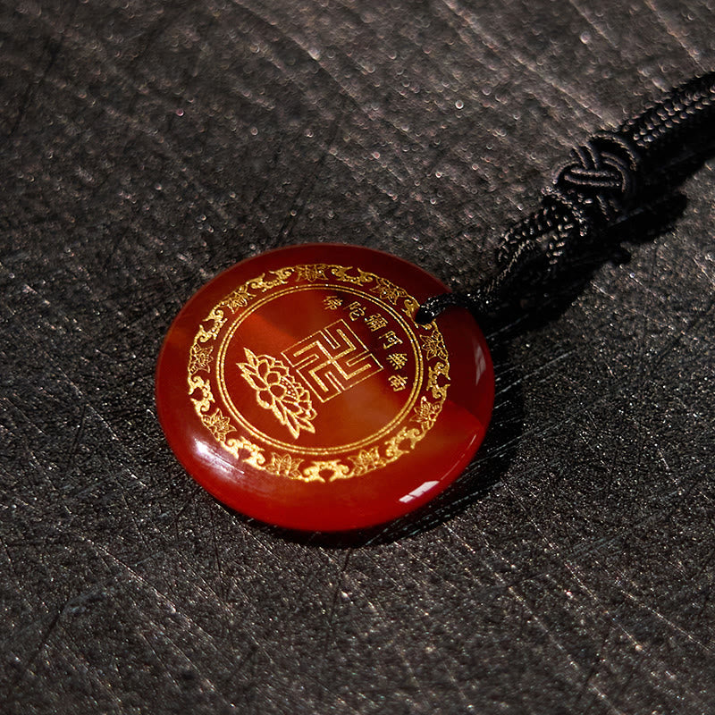 Carnelian Purification Pendant - deep amber-red stone gold swastika border, dark stone texture, bold contrast