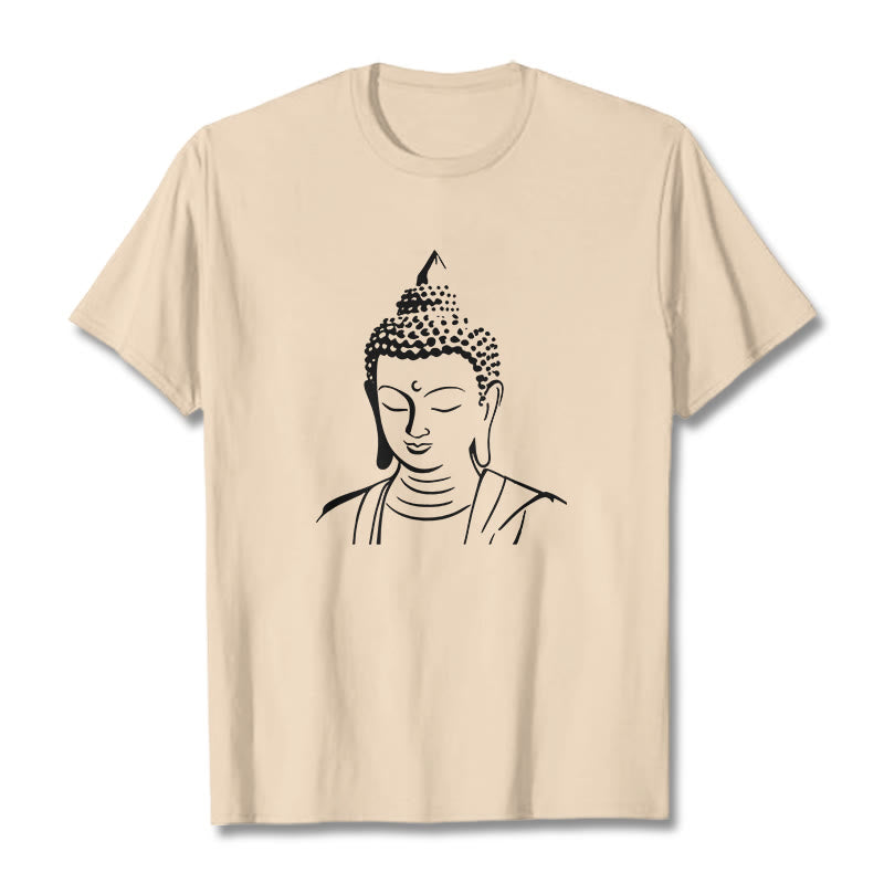 Buddha Head Cotton T-Shirt – Folded neatly on table with tag visible, retail presentation, brand label