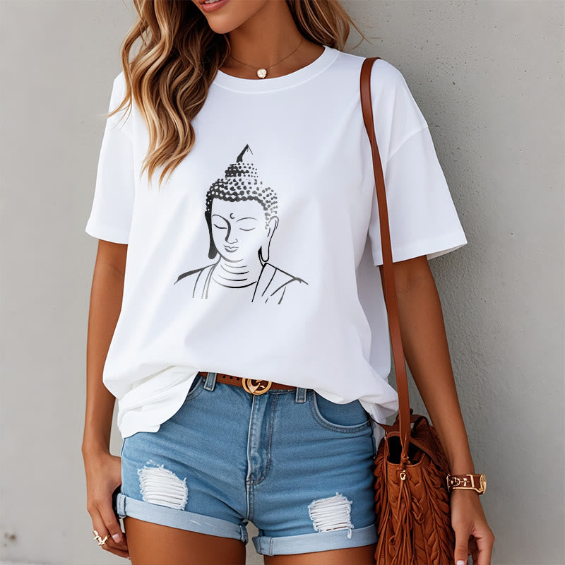 Buddha Head Cotton T-Shirt – Female model styled with jeans, unisex everyday wear, modern spiritual