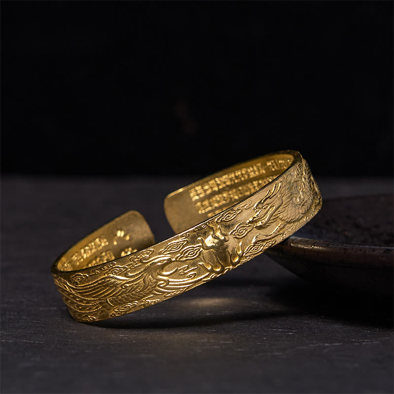 Dragon Phoenix Heart Sutra Copper Bracelet – Low-angle on dark prop, dragon relief and inner sutra, Devotional
