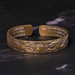 Dragon Phoenix Heart Sutra Copper Bracelet – Angled shot on dark marble, flaming pearl between creatures, Sacred