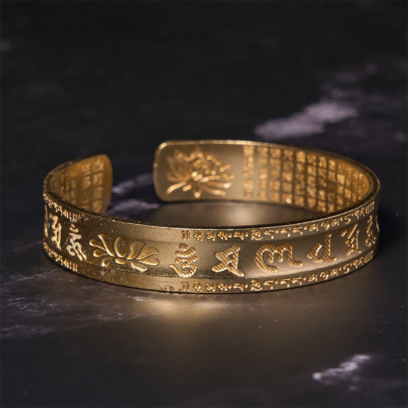 Heart Sutra Lotus Cuff Bracelet - matte gold with dual-surface sacred engraving, centered