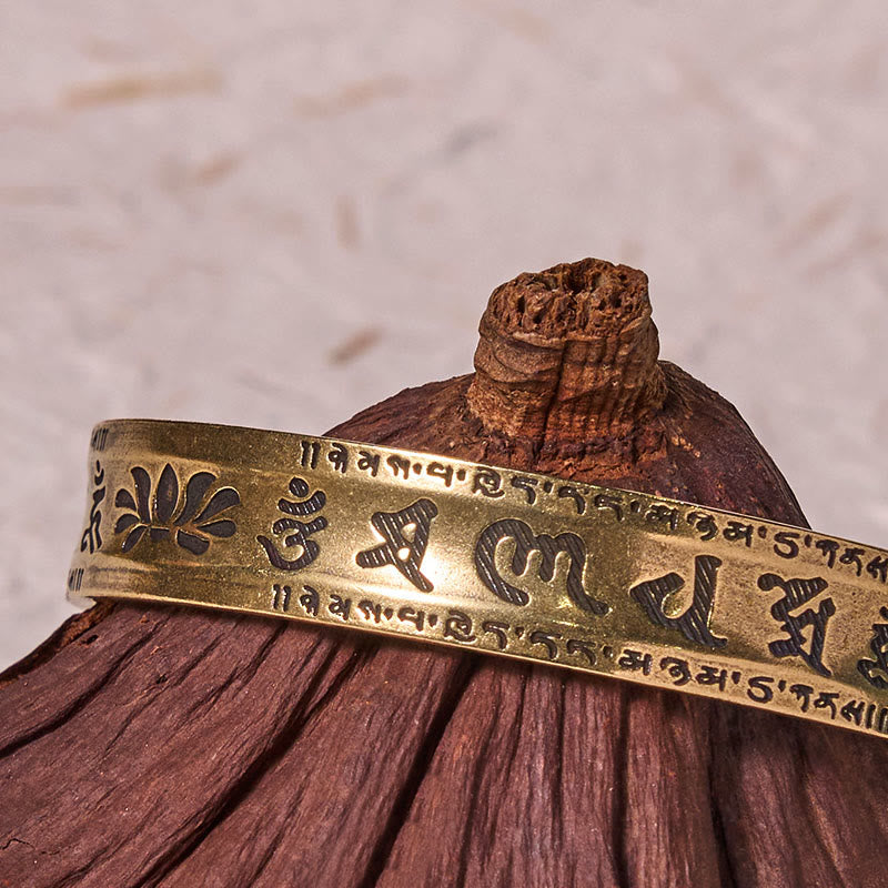 Heart Sutra Lotus Cuff Bracelet - carved lotus and mantra on natural wood, tranquil