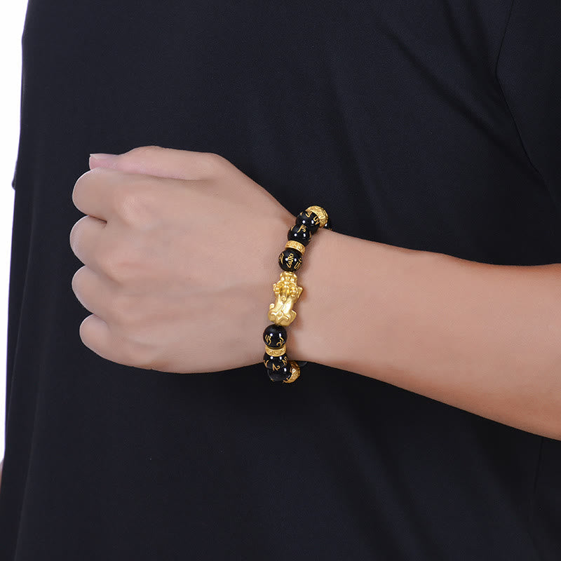 Black Obsidian PiXiu Om Mani Padme Hum Bracelet – worn on man's wrist with black shirt, lifestyle shot, protection jewelry