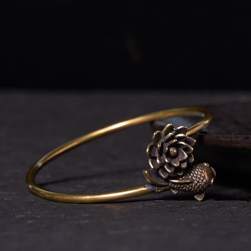Lotus Koi Fish Copper Brass Luck Bangle – low side view of antiqued brass cuff, lotus and fish finial, oxidized finish