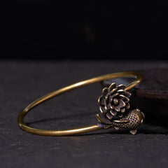 Lotus Koi Fish Copper Brass Luck Bangle – low side view of antiqued brass cuff, lotus and fish finial, oxidized finish