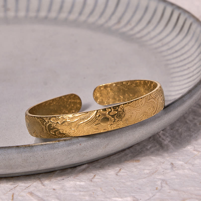 Dragon Phoenix Copper Brass Bracelet – Three-quarter on gray ceramic, engraved dragon cloud motifs, Traditional