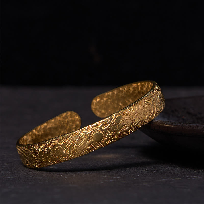 Dragon Phoenix Copper Brass Bracelet – Low-angle on dark slate, full relief engraving detail, Handcrafted
