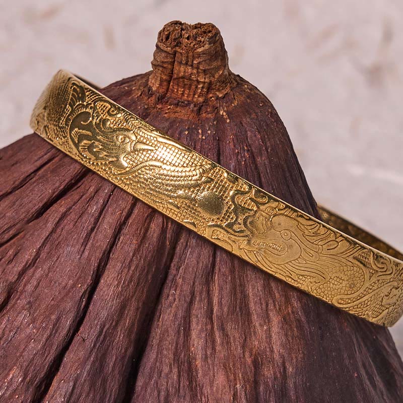 Dragon Phoenix Copper Brass Bracelet – Close-up on dried botanical prop, dragon scale relief, Fortunate