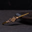 PiXiu Copper Bangle – Antique brass cuff with PiXiu and compass charm on dark plate side view