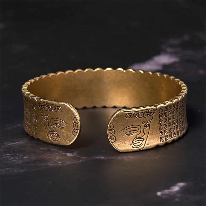 Heart Sutra Lotus Copper Cuff Bracelet – engraved Buddha faces on terminals with sacred calligraphy, antique brass, mindful