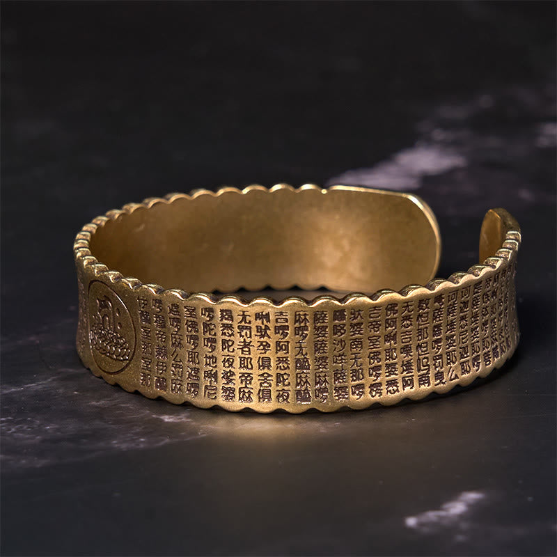 Heart Sutra Lotus Copper Cuff Bracelet – Buddha medallion ends with engraved sutra and scalloped edges, sacred, contemplative