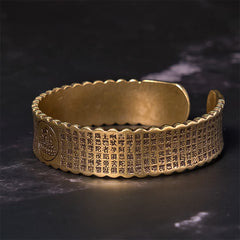 Heart Sutra Lotus Copper Cuff Bracelet – Buddha medallion ends with engraved sutra and scalloped edges, sacred, contemplative
