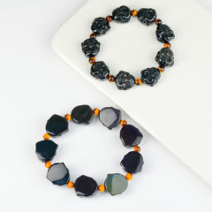 Rainbow Obsidian Laughing Buddha Bracelet – Close-up of rainbow sheen on obsidian beads, iridescent flash