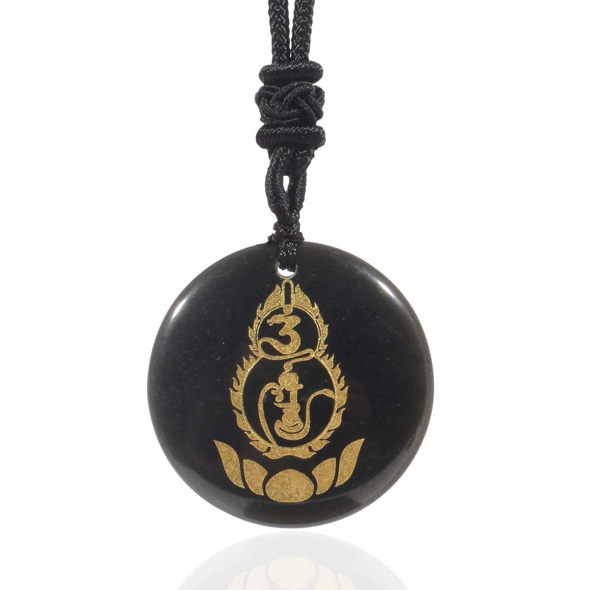 Black Obsidian Mantra Pendant – polished black disc with gold Buddha and lotus engraving, black woven cord, protective talisman Imagen principal del producto