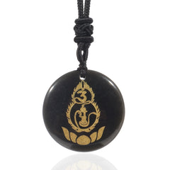 Black Obsidian Mantra Pendant – polished black disc with gold Buddha and lotus engraving, black woven cord, protective talisman