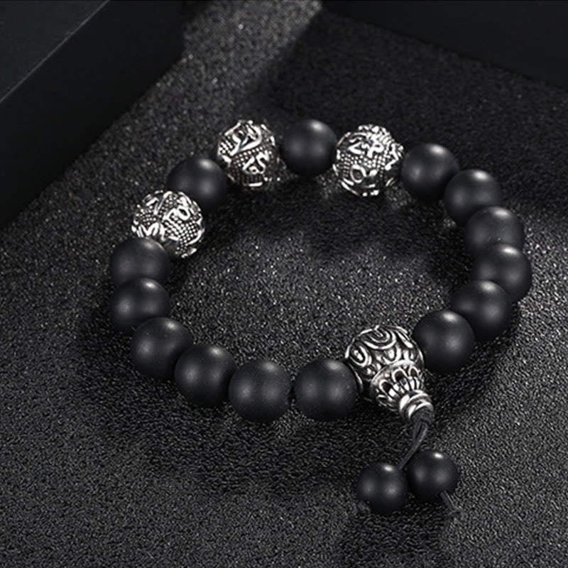 Tiger Eye Lava Rock Obsidian Om Mani Padme Hum Bracelet – obsidian angled black surface, sleek defense