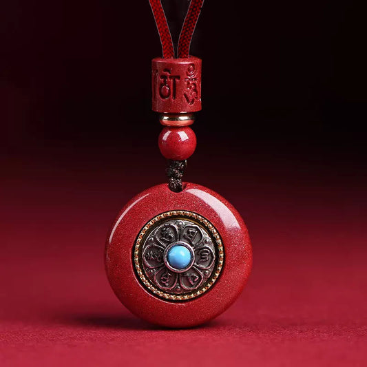 Natural Cinnabar Om Mani Padme Hum Pendant – Frontal view with turquoise center and lotus inlay, cinnabar spiritual jewelry