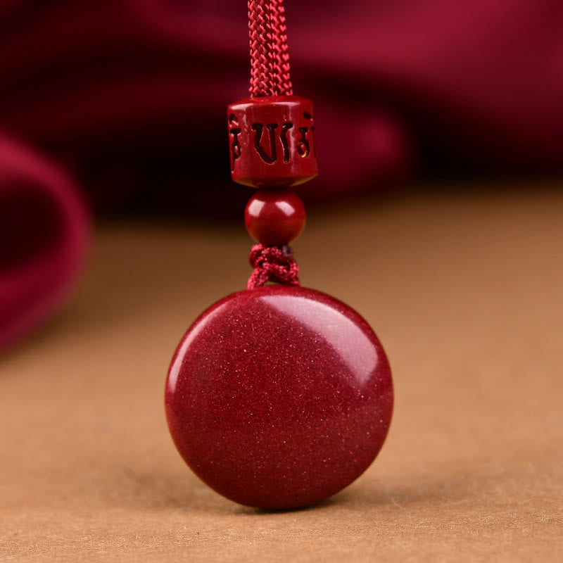 Natural Cinnabar Om Mani Padme Hum Pendant – Carved bead detail with braided red cord, Buddhist blessing necklace