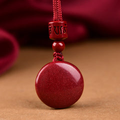 Natural Cinnabar Om Mani Padme Hum Pendant – Carved bead detail with braided red cord, Buddhist blessing necklace