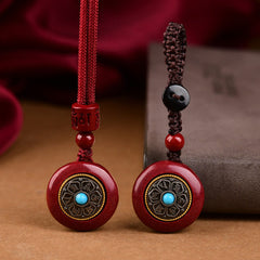 Natural Cinnabar Om Mani Padme Hum Pendant – Dual cord options with red and dark braided strings, protection amulet