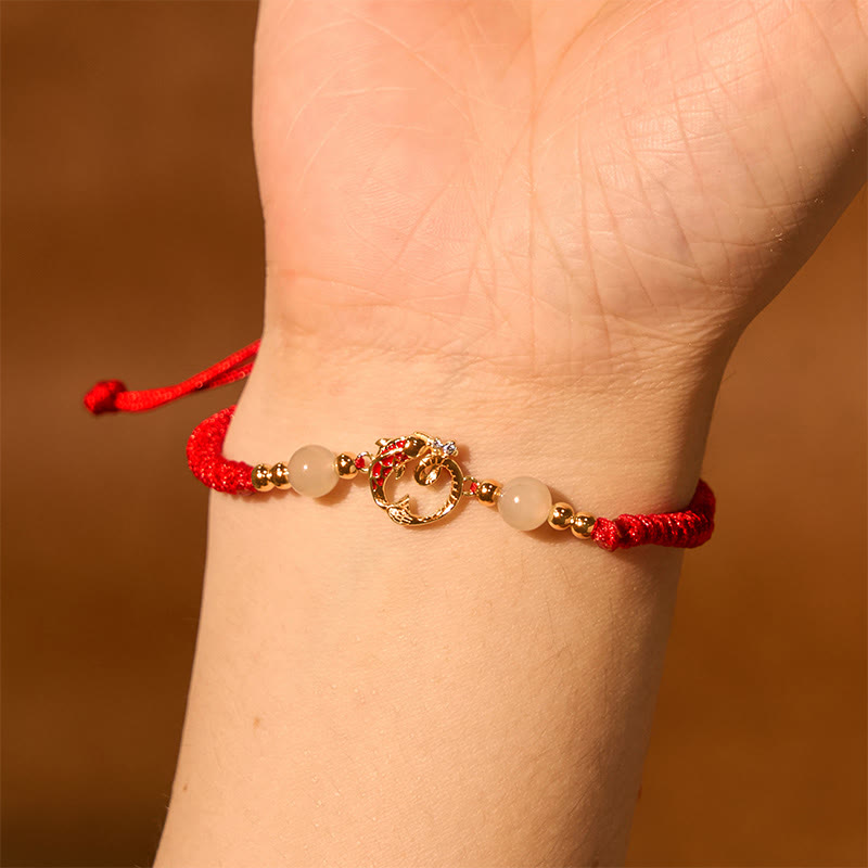 Silver Jade Cinnabar Koi Snake Bracelet – gold snake charm worn on wrist, amber background, zodiac protection jewelry