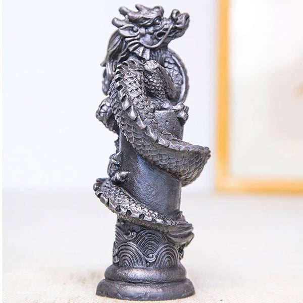 Flying Dragon Pillar Resin Statue – three-quarter angle with gold picture frame backdrop, wave base, fortune