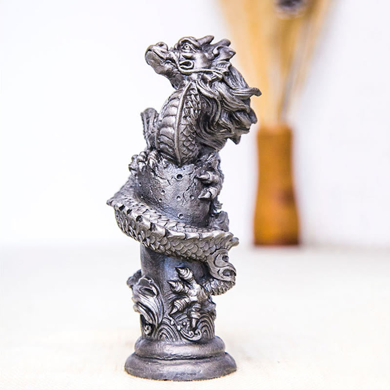 Flying Dragon Pillar Resin Statue – three-quarter side on white with amber vase in bokeh, protective dragon